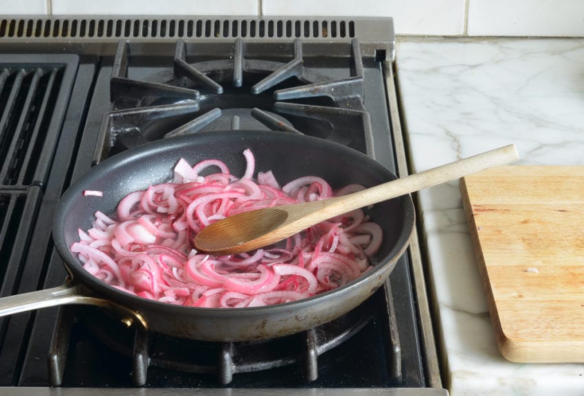 Wilted onions on the stovetop.