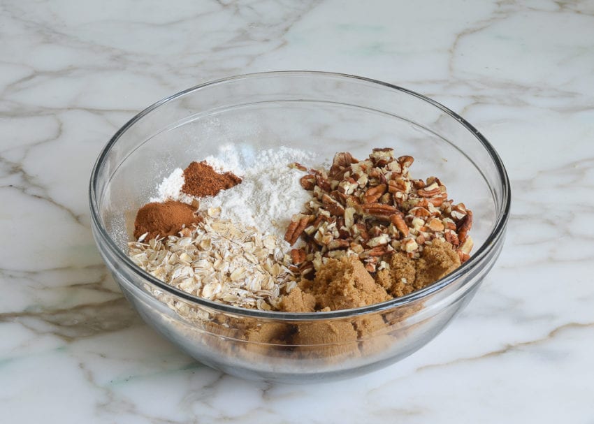 Bowl of unmixed dry ingredients and nuts.