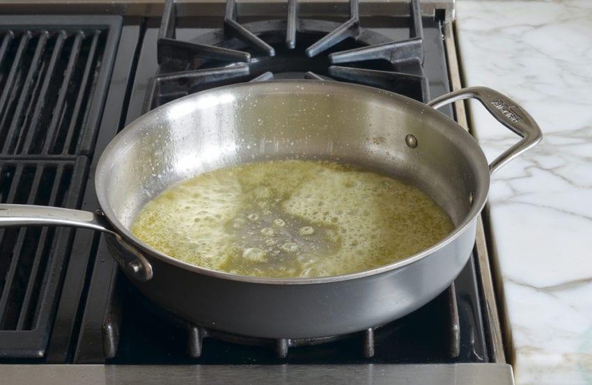 Skillet of melted butter.