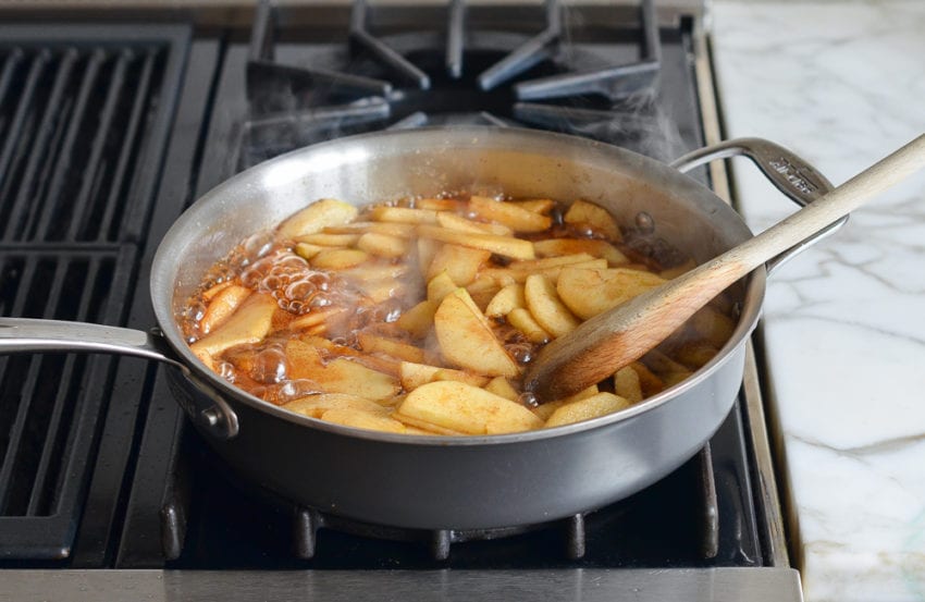 Boiling apple mixture in a skillet.