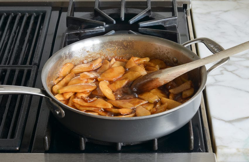 Skillet of apples and sugar-syrup.