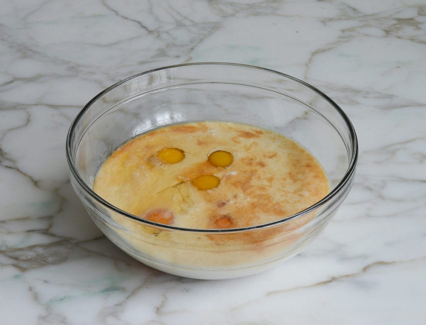 Bowl of unmixed custard ingredients.