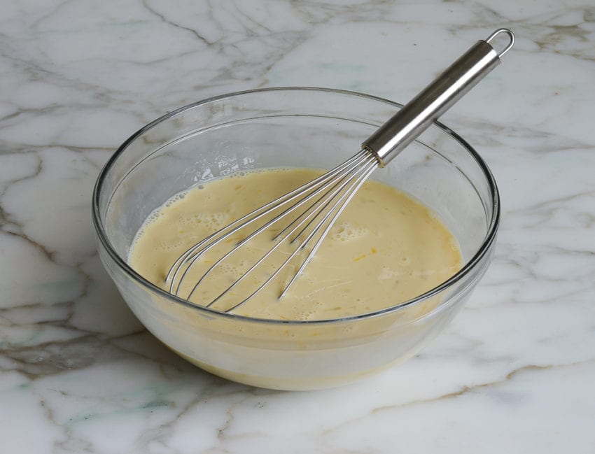 Whisk in a bowl of custard.