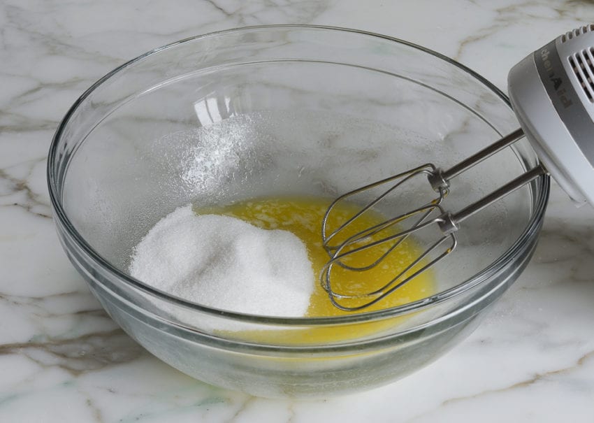 Melted butter and sugar in a bowl.