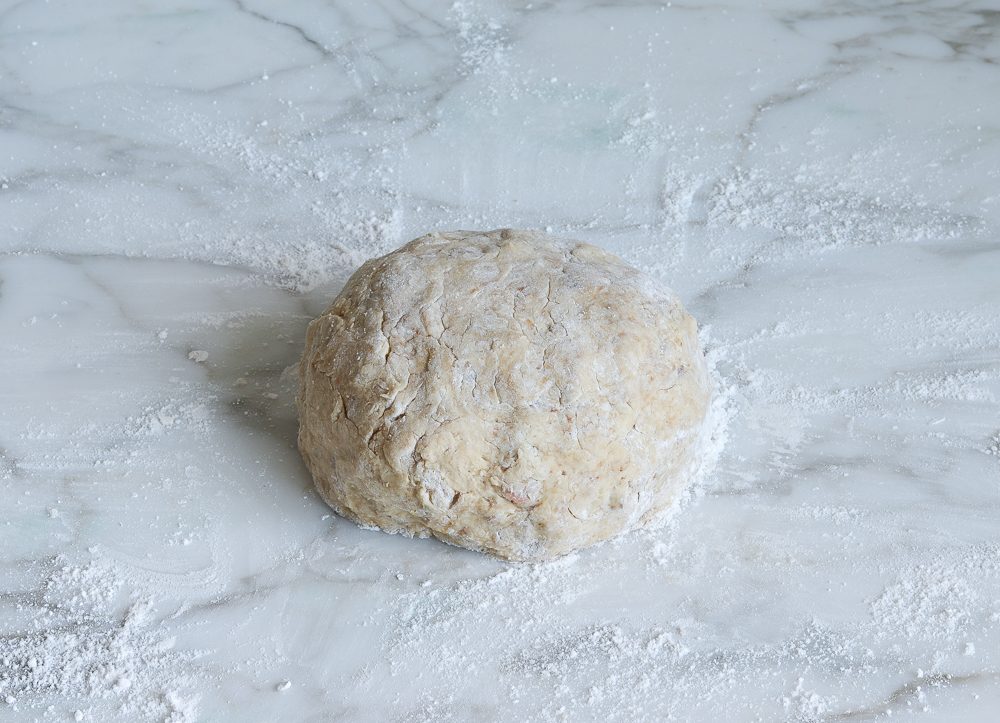 Ball of butterscotch pecan scone dough.