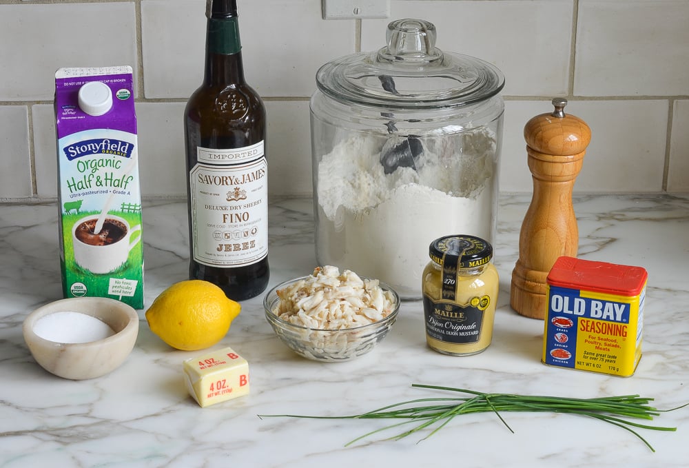 Soup ingredients including lemon, half and half, and Old Bay seasoning.