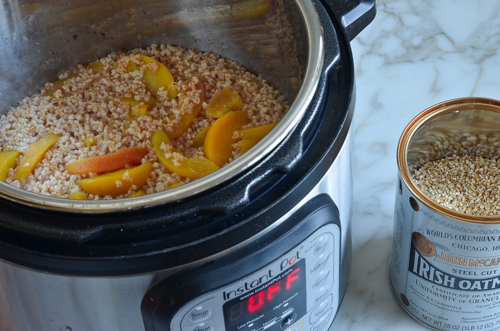 Cooked oats in an Instant Pot with peaches.