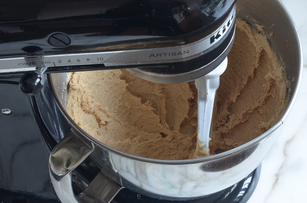 Stand mixer of creamed butter and sugars.