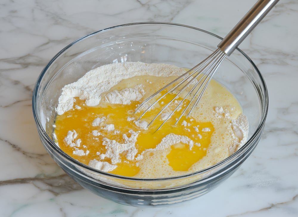 adding the milk mixture and melted butter to the dry ingredients