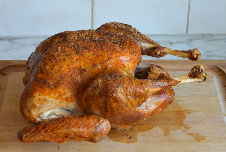 Roasted turkey on a cutting board.