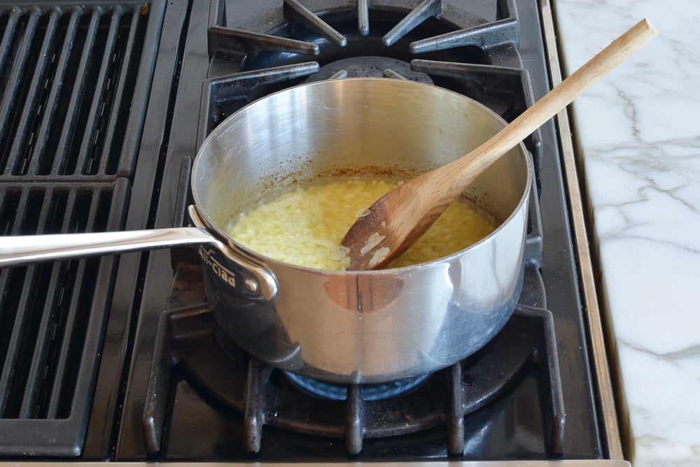 Cooked onions in a sauce pan.
