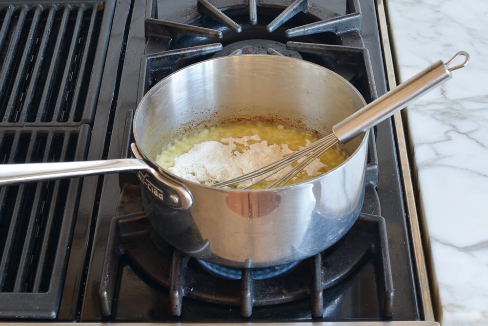Flour in a sauce pan with onions.