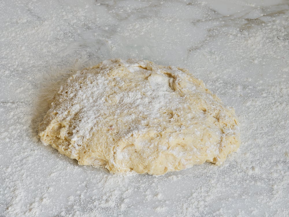 Dough on a floured countertop.