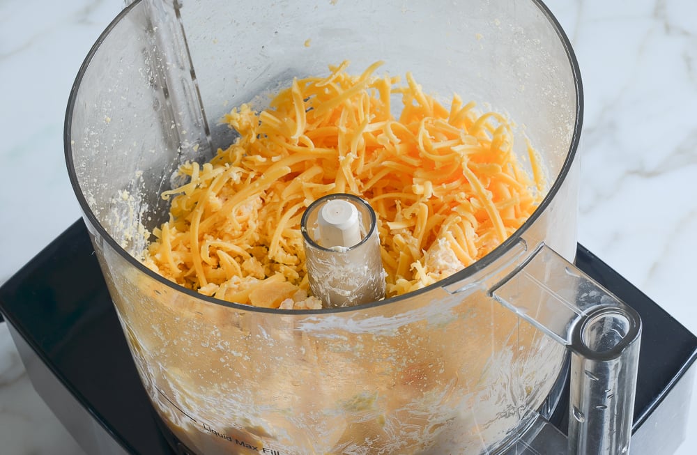 Shredded cheese in a food processor.