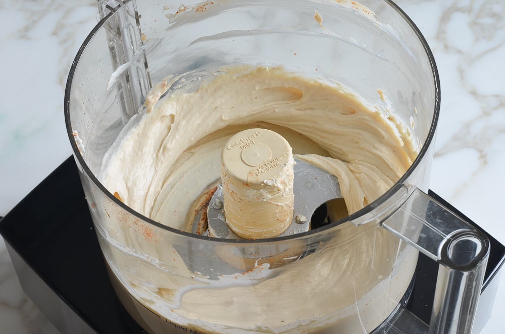 Cream cheese mixture in the processor blended with seasonings.
