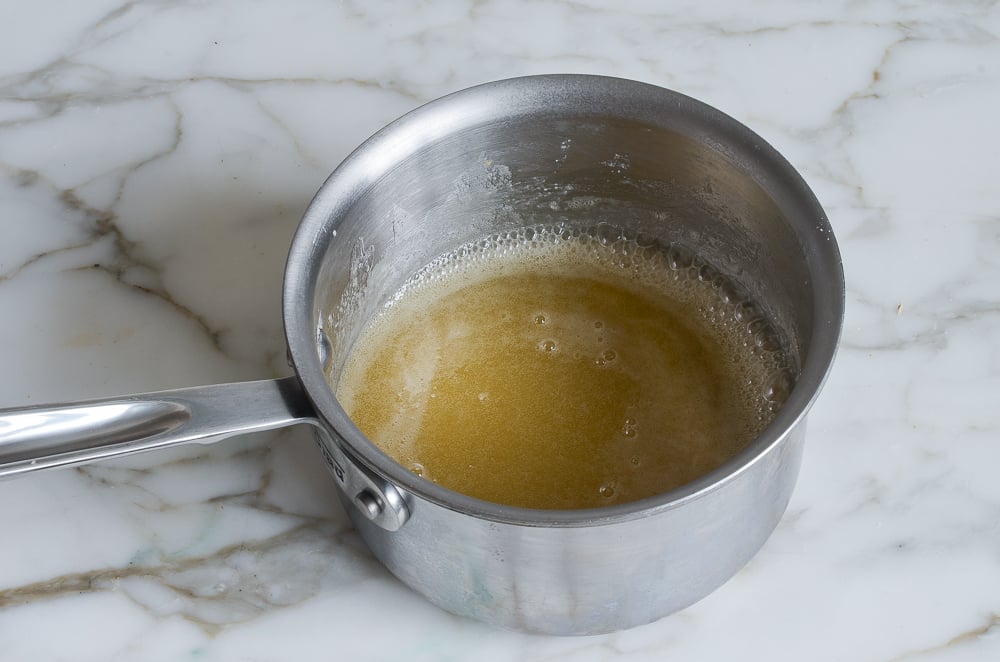 Small sauce pan of cake glaze.
