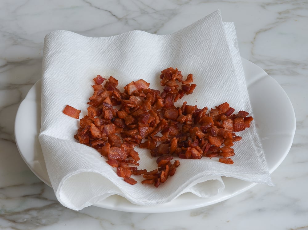 Diced bacon on paper towels.