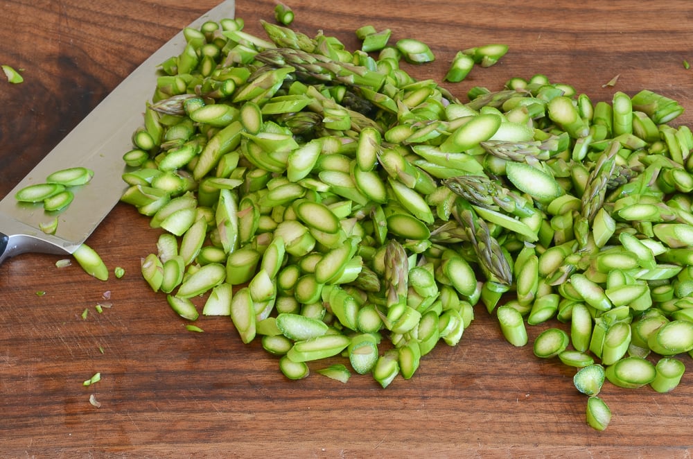 thinly slicing asparagus