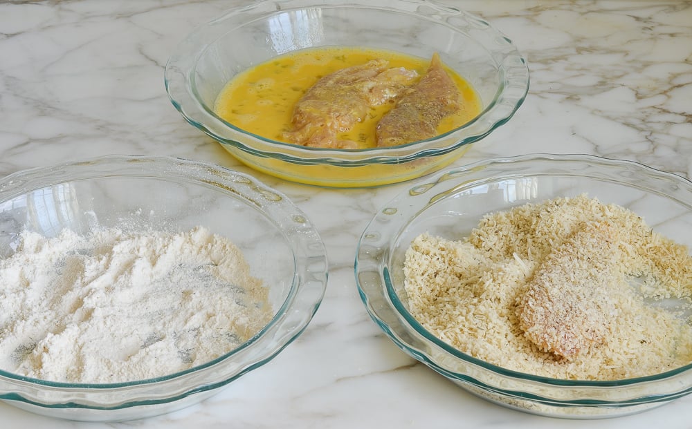 dipping chicken in eggs and then panko mixture