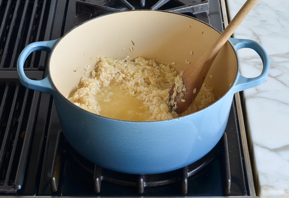 adding the broth little by little