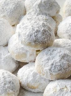 Pile of coconut-lime Mexican wedding cookies.