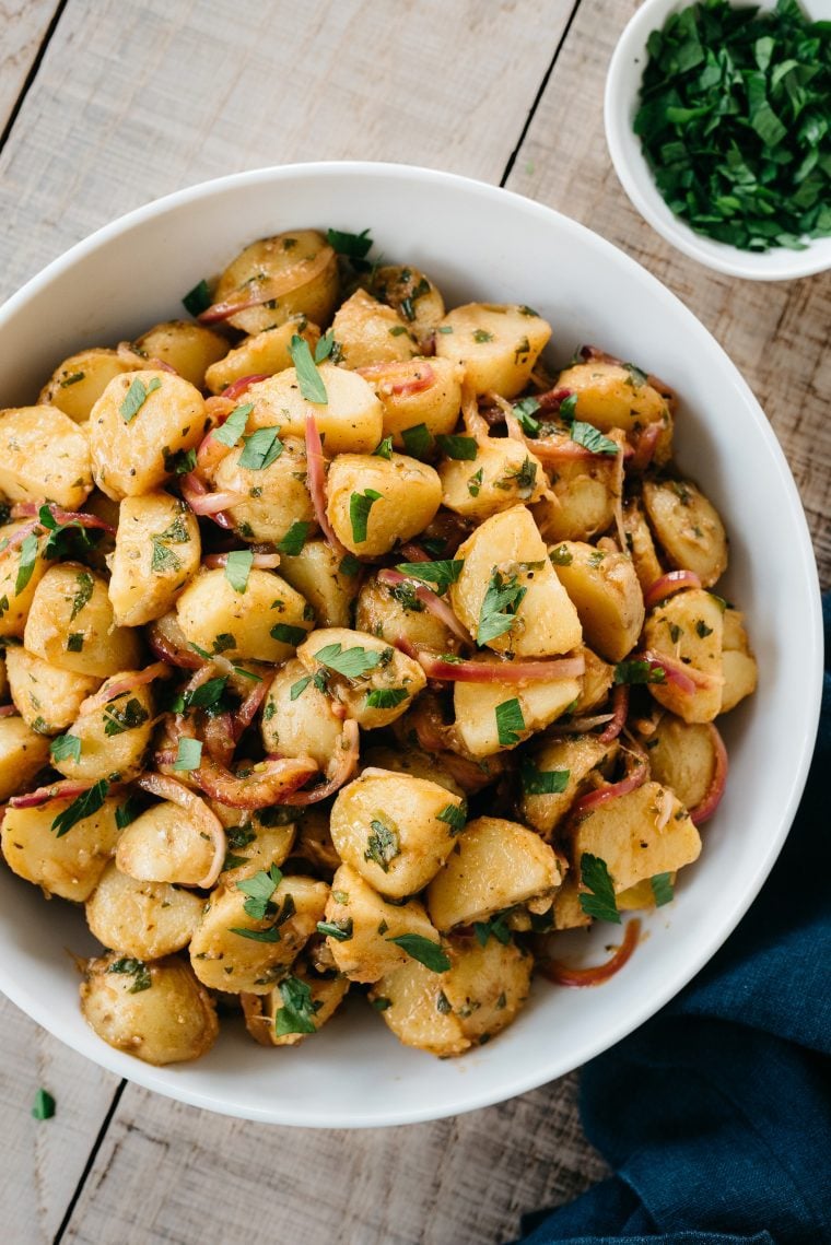 White bowl of German potato salad.