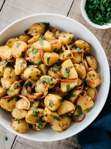 White bowl of German potato salad.