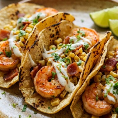 Shrimp tacos with corn, bacon, and lime crema