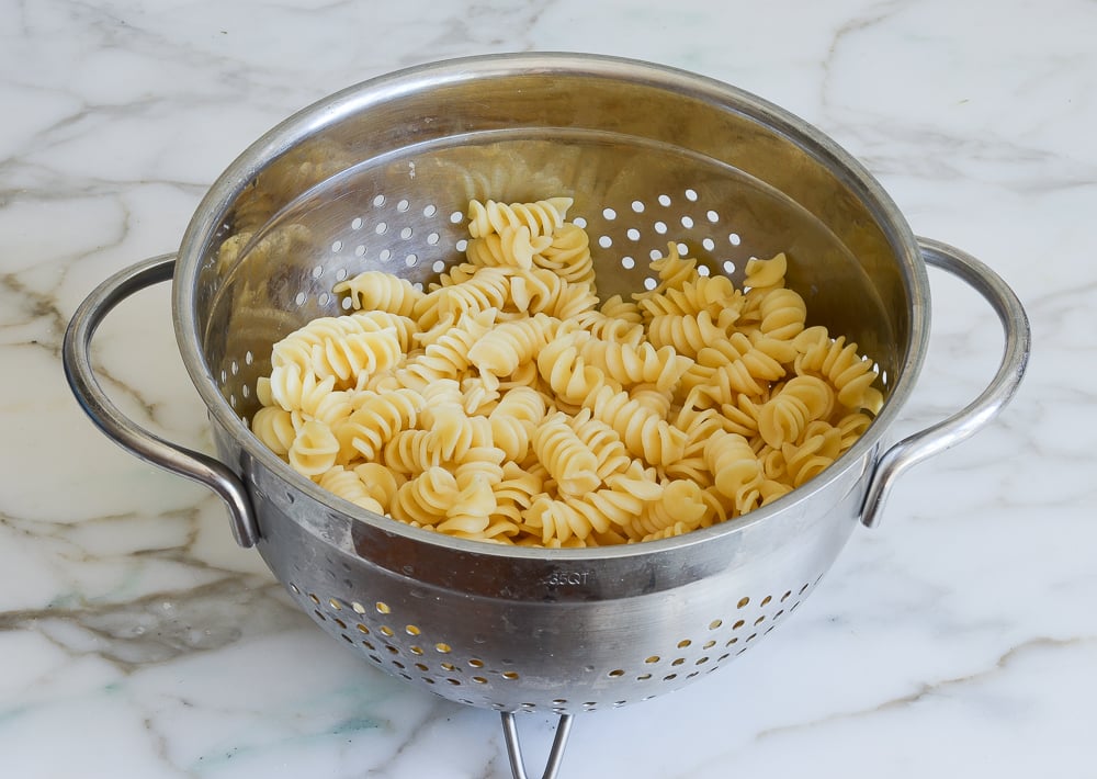 Colander of drained pasta.