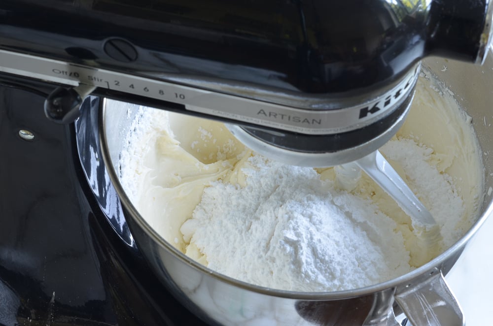 Sugar in a stand mixer with batter.