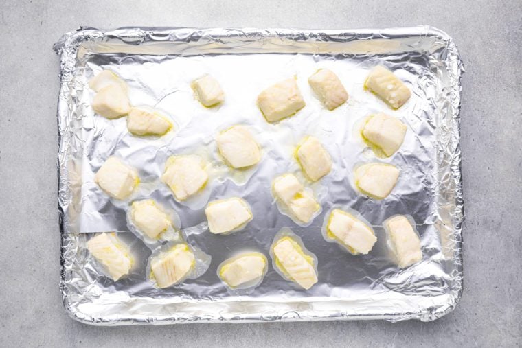 chunks of fish on baking sheet