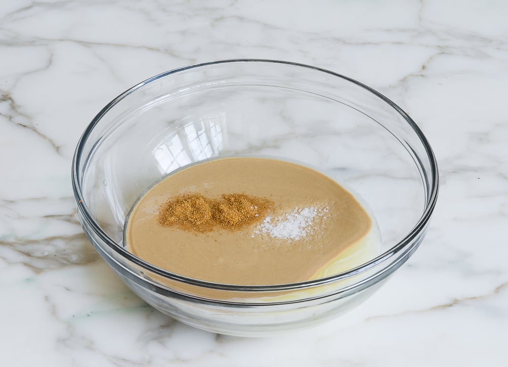 lemon mixture, tahini, cumin and salt in mixing bowl