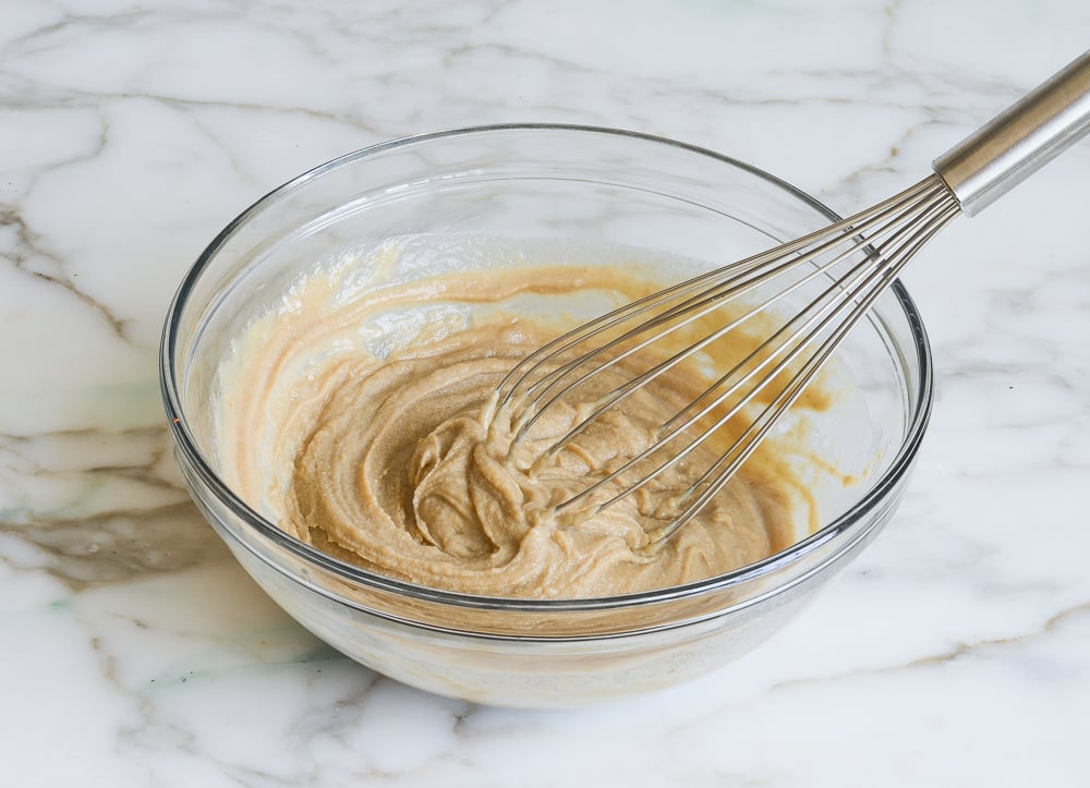 Whisk in a bowl of seized mixture.
