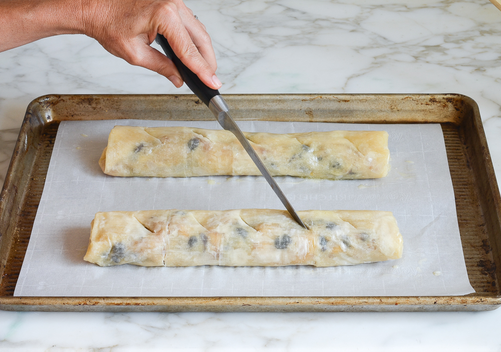 cutting slits in the strudels to vent
