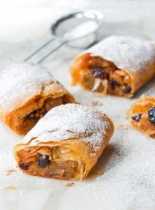 Apple strudel dusted with powdered sugar.