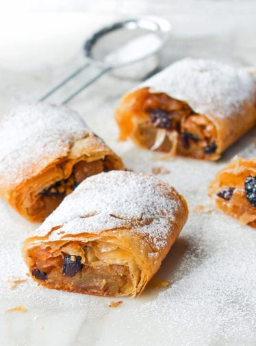 Apple strudel dusted with powdered sugar.