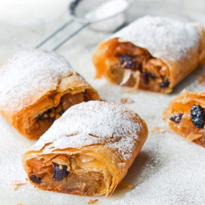Apple strudel dusted with powdered sugar.
