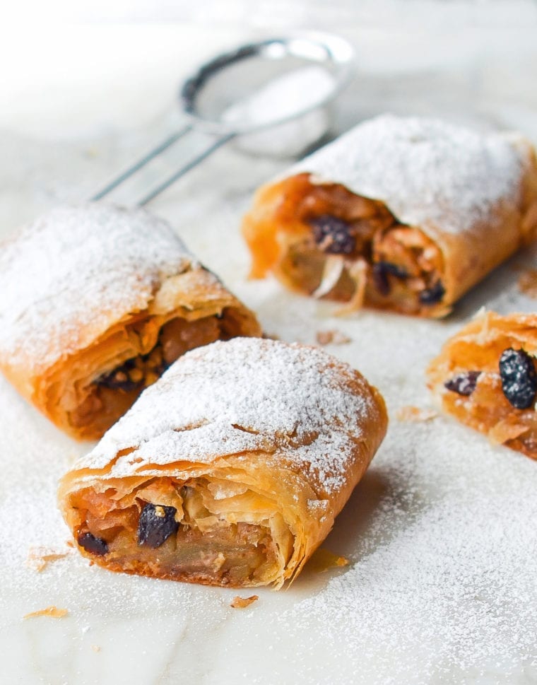 Apple strudel dusted with powdered sugar.