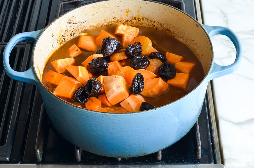 adding the sweet potatoes and prunes