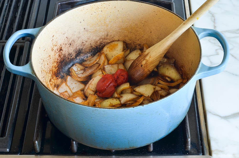 adding the tomato paste