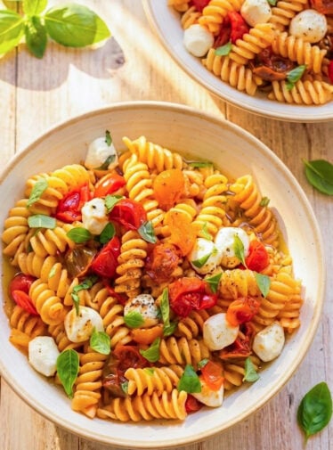 bowls of fusilli caprese on table