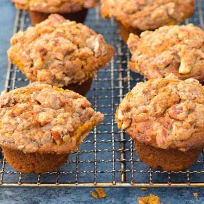 Pumpkin muffins on a wire rack.