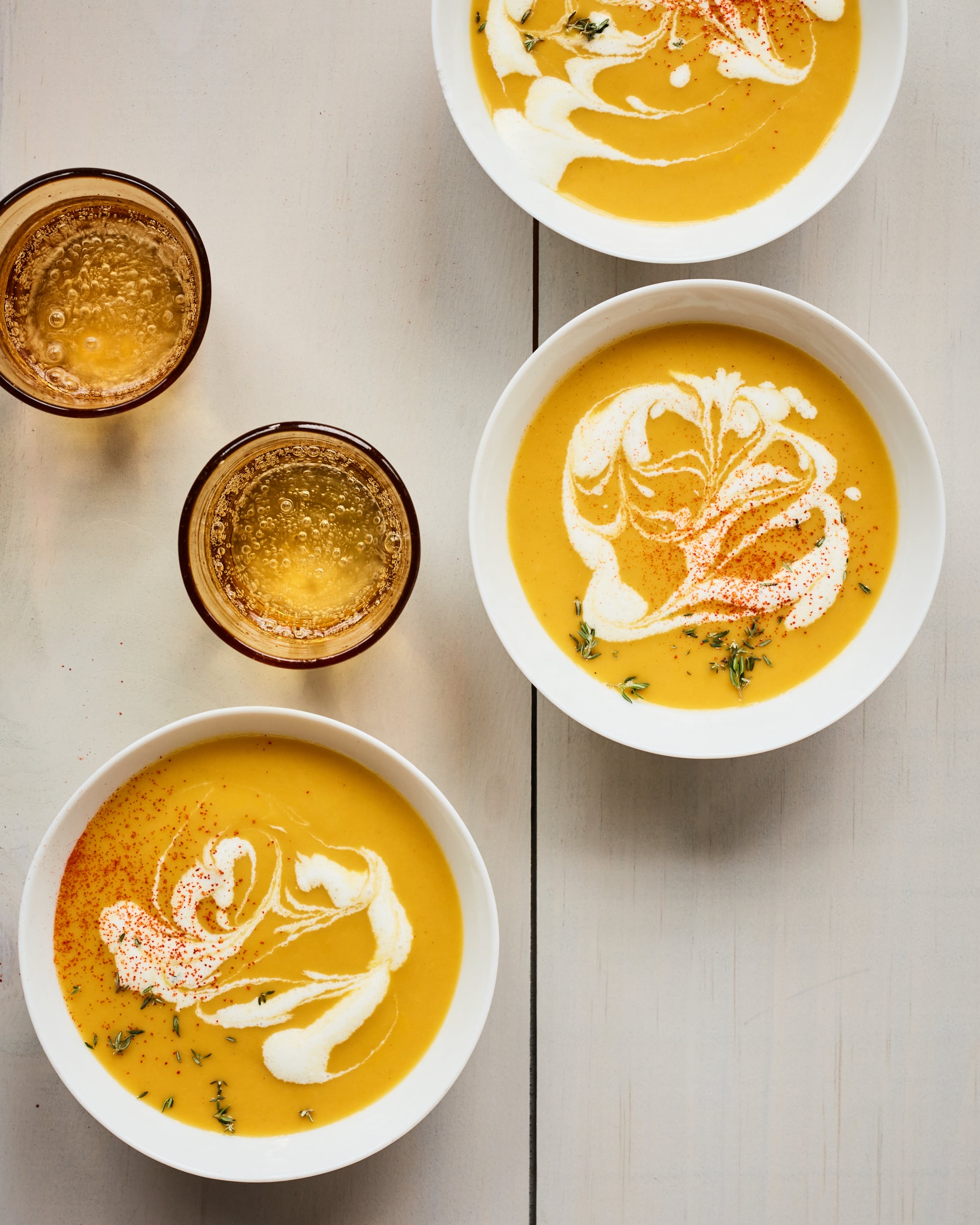 Bowls of pumpkin soup.