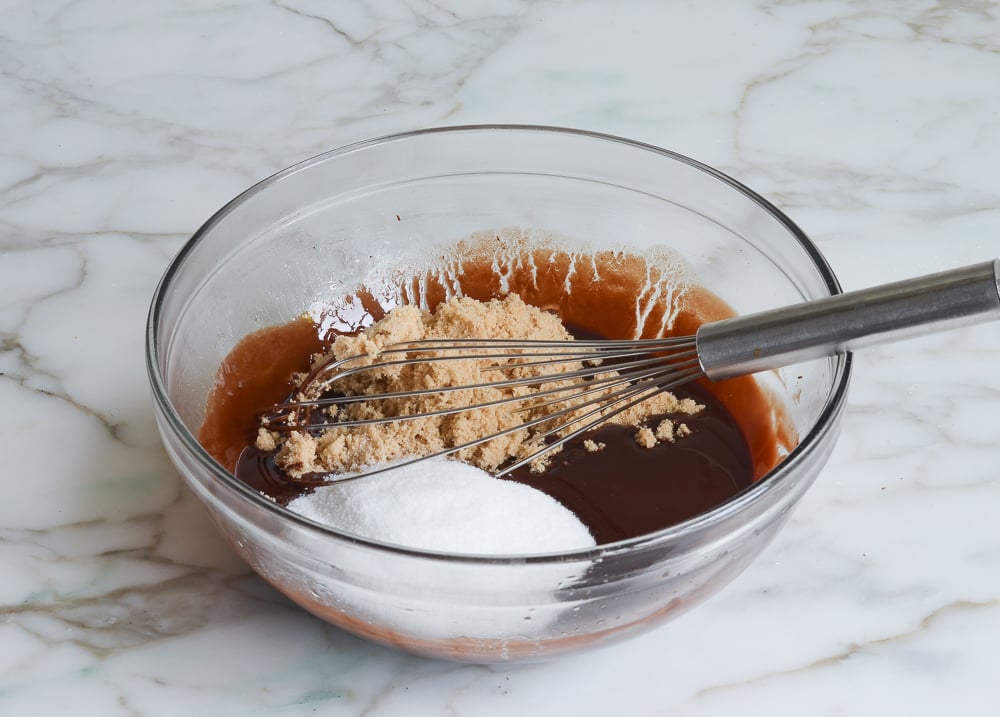 adding the sugars to the chocolate mixture