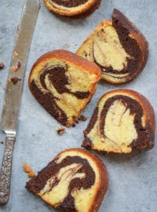 Slices of marble cake with a butter knife.
