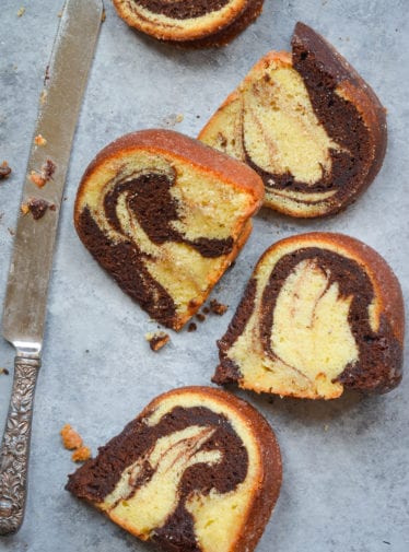 Slices of marble cake with a butter knife.