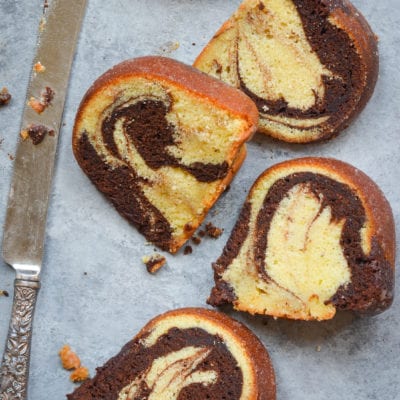 Slices of marble cake with a butter knife.