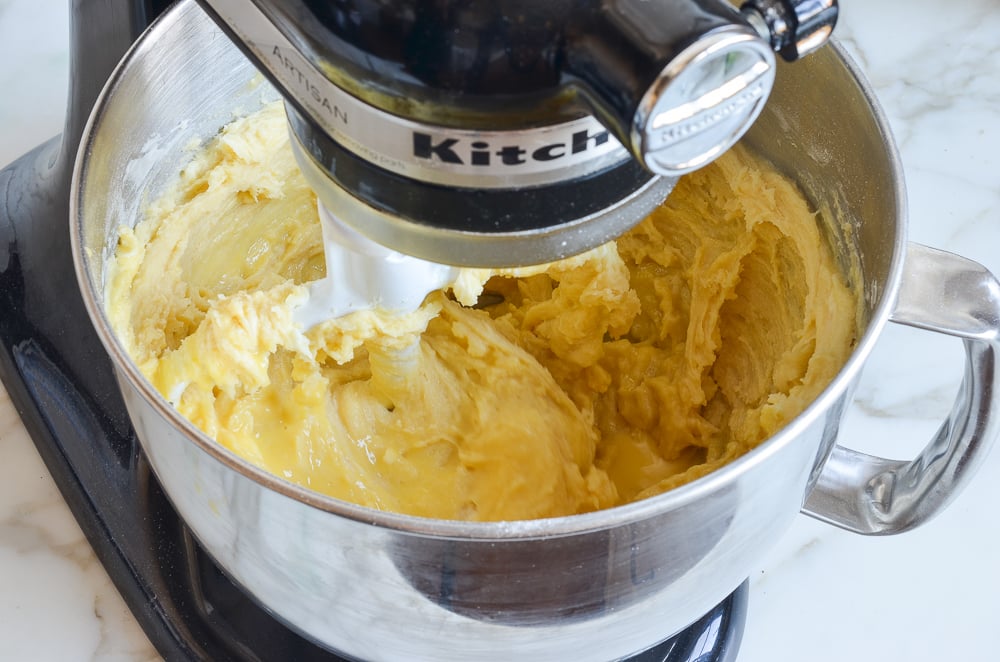 Gradually adding the buttermilk mixture.