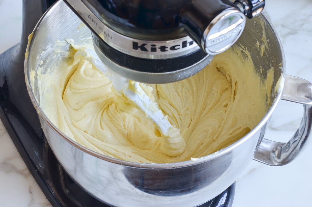 Finished vanilla batter in the bowl of a stand mixer.