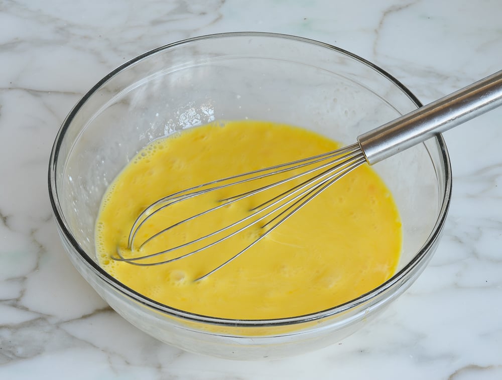 Whisked buttermilk and egg mixture to make a marble cake.